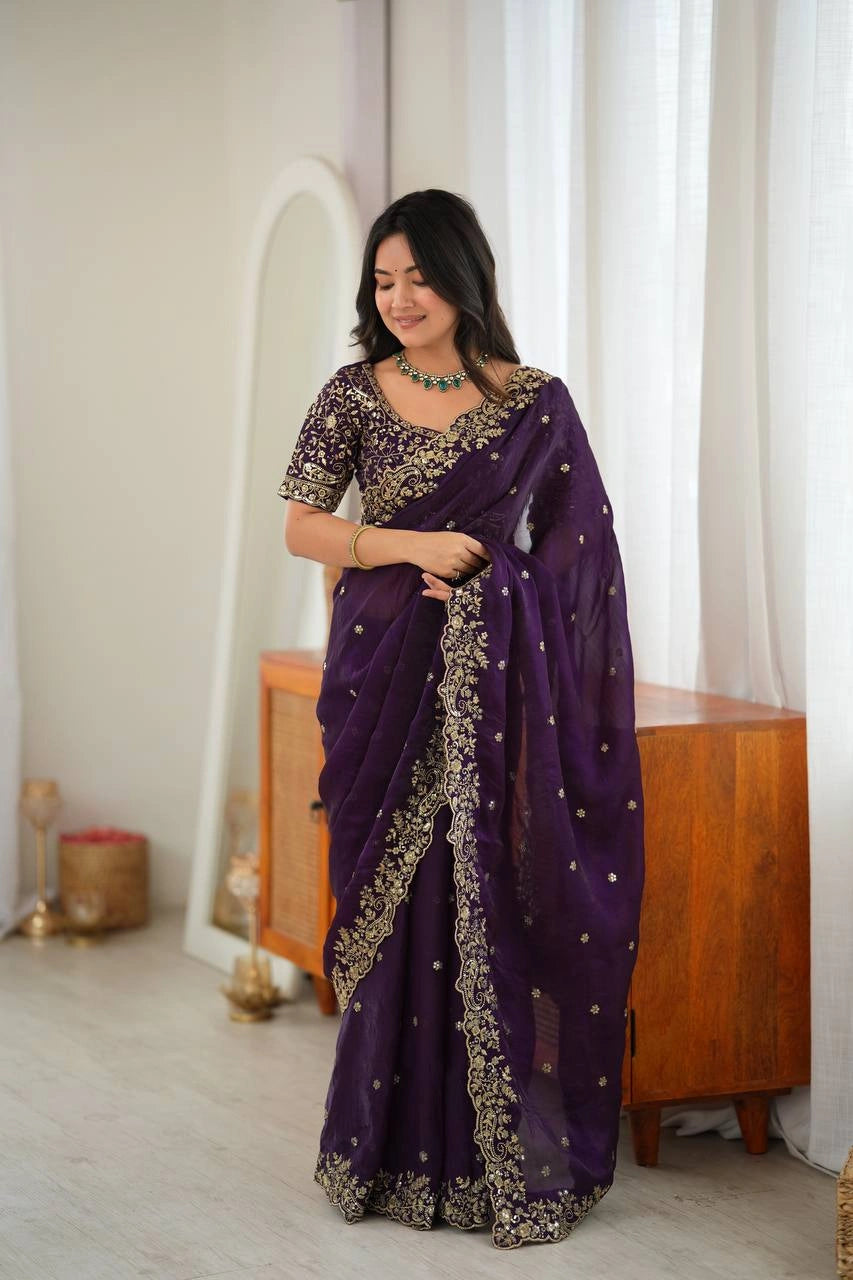 Dark Purple saree on model showing embroidered pallu
